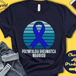 May include: Navy blue t-shirt with a blue ribbon and a sunset graphic. The text "Polymyalgia Rheumatica Warrior" is printed on the shirt.