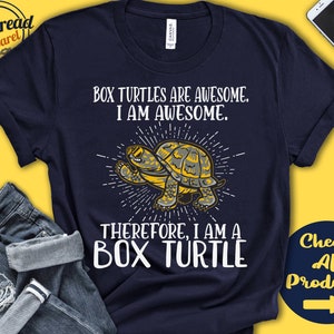 May include: A navy blue t-shirt with a white graphic of a box turtle. The text on the shirt reads "Box turtles are awesome. I am awesome. Therefore, I am a box turtle."