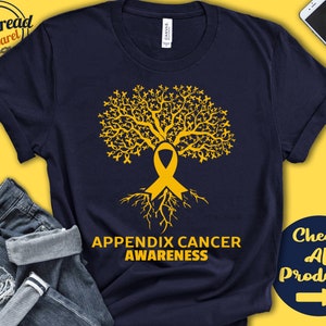 Puede incluir: Camiseta azul marino con un diseño de árbol de cinta amarilla y el texto "Appendix Cancer Awareness".