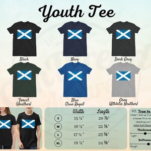 May include: Youth tee shirt with a Scottish flag design in various colors, including black, navy, dark grey, forest heather, blue, and grey. The size chart shows measurements in inches for width and length.