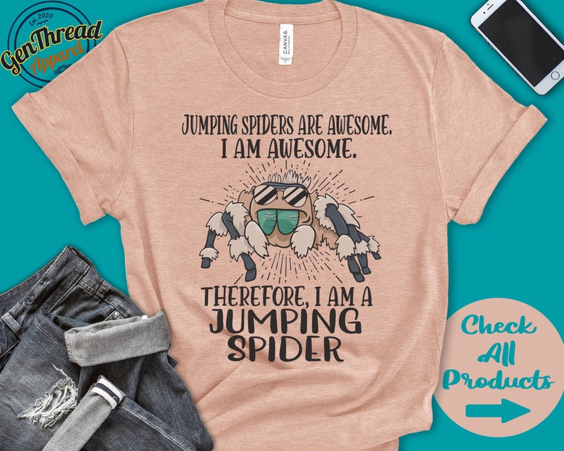 May include: A light pink t-shirt with a cartoon jumping spider wearing sunglasses. The text on the shirt reads "Jumping spiders are awesome. I am awesome. Therefore, I am a jumping spider."