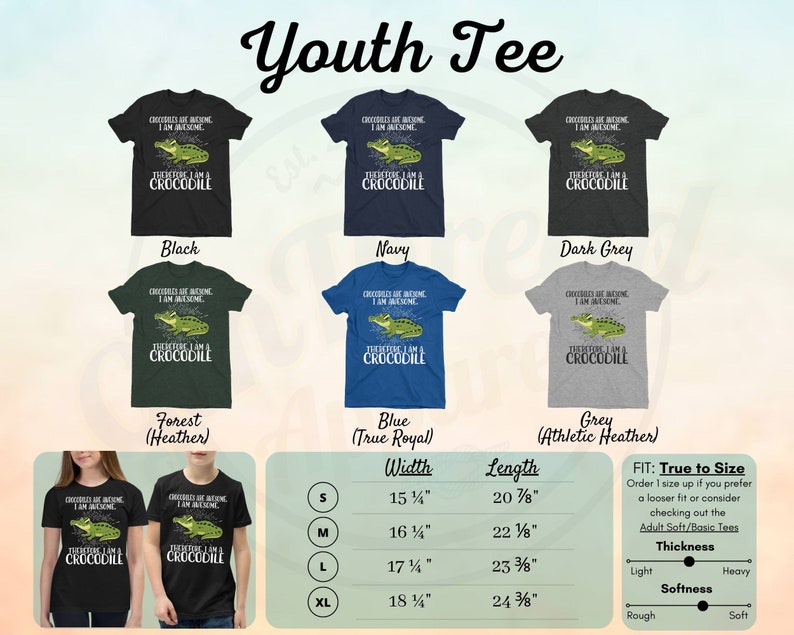 May include: Youth t-shirt design featuring a green crocodile with the text "Crocodiles are awesome, I am awesome, Therefore I am a crocodile". The shirt is available in black, navy, dark grey, forest (heather), blue (true royal), and grey (athletic heather). The size chart shows width and length measurements in inches for sizes S, M, L, and XL. The fit is described as "true to size" and the thickness and softness are described as light/rough, heavy/soft.