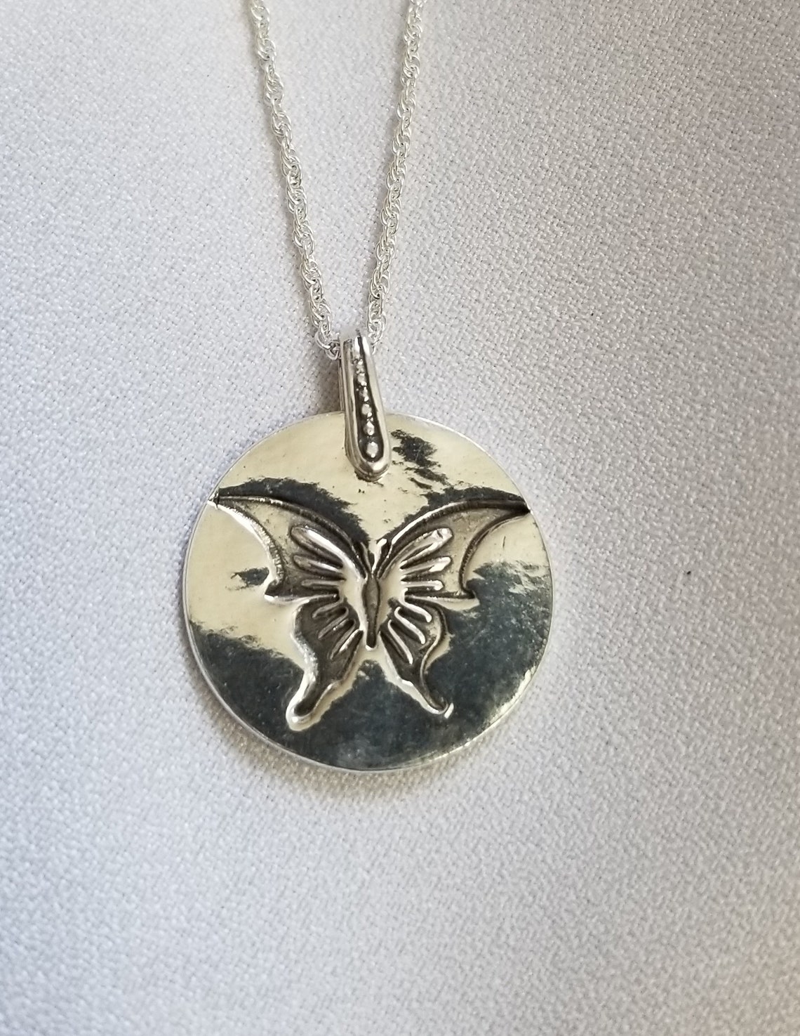 Pendentif papillon argent et ambre