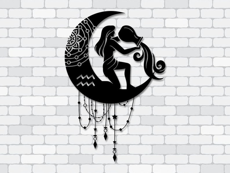 May include: Black metal wall art depicting the Aquarius zodiac sign. A woman pours water from a jug, seated on a crescent moon with decorative details. The design includes hanging beads and star accents.