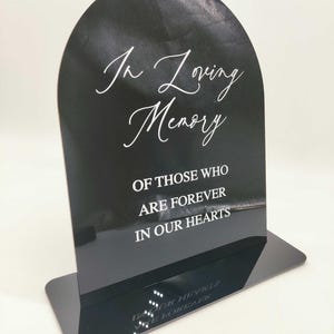 May include: A rustic wooden sign with the text "Welcome to our home" in white lettering. The sign features a distressed finish and a simple, inviting design, perfect for a front porch or entryway.