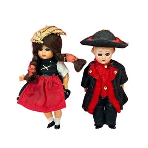 Vintage Black Forest German Miniature Plastic Pair of Doll wearing Traditional Clothes.