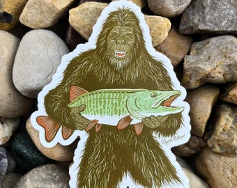 Ultimate Angler - Bigfoot holding a musky sticker design by Ryan Ebert