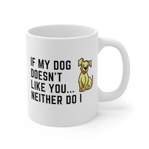 May include: White ceramic coffee mug with a black graphic that reads "If my dog doesn't like you... neither do I". A cartoon image of a yellow dog is to the right of the text.