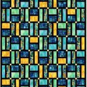 May include: A colorful quilt with a geometric pattern. The design features rectangular and square blocks in shades of blue, green, and gold, set against a black background. The quilt is likely made of fabric and is suitable for a bed or wall hanging.