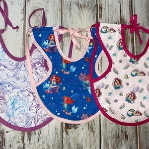 Adjustable Bapron Bib (Waterproof, adjustable, Ties in back making it hard for child to remove) Listing for One Bib