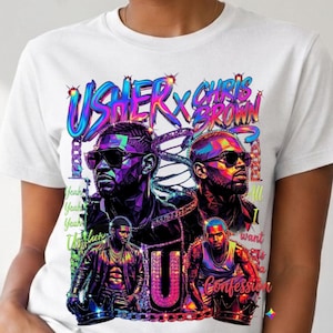 K&ouml;nnte beinhalten: Ein wei&szlig;es T-Shirt mit einem lebendigen, mehrfarbigen Grafikdruck von Usher und Chris Brown. Das Design zeigt stilisierte Portr&auml;ts, den Text "USHER x CHRIS BROWN", "Yeah", "All I want is a Confession" sowie einen gro&szlig;en Buchstaben "U" mit Ketten.