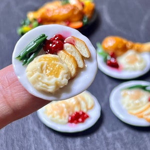 1:12 miniature turkey dinner for dolls and doll houses.  1 12 turkey on platter, 1 12 sliced turkey on platter, turkey dinner plates