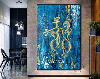 May include: A large rectangular wall art piece featuring a textured deep blue background with gold leaf accents. The painting depicts two stylised golden figures, one playing a flute, with the text Lavanya Art in the lower left corner.