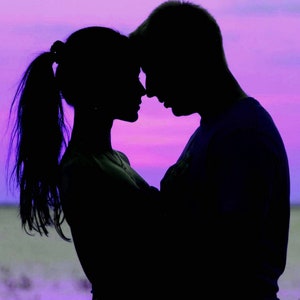 May include: A silhouette of a couple in an embrace, with their faces touching. The woman's hair is in a ponytail. The background is a gradient of purple and pink, reminiscent of a sunset or sunrise.