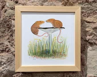 May include: A framed illustration of two brown mice sitting on a white mushroom with green grass and yellow flowers in the background.