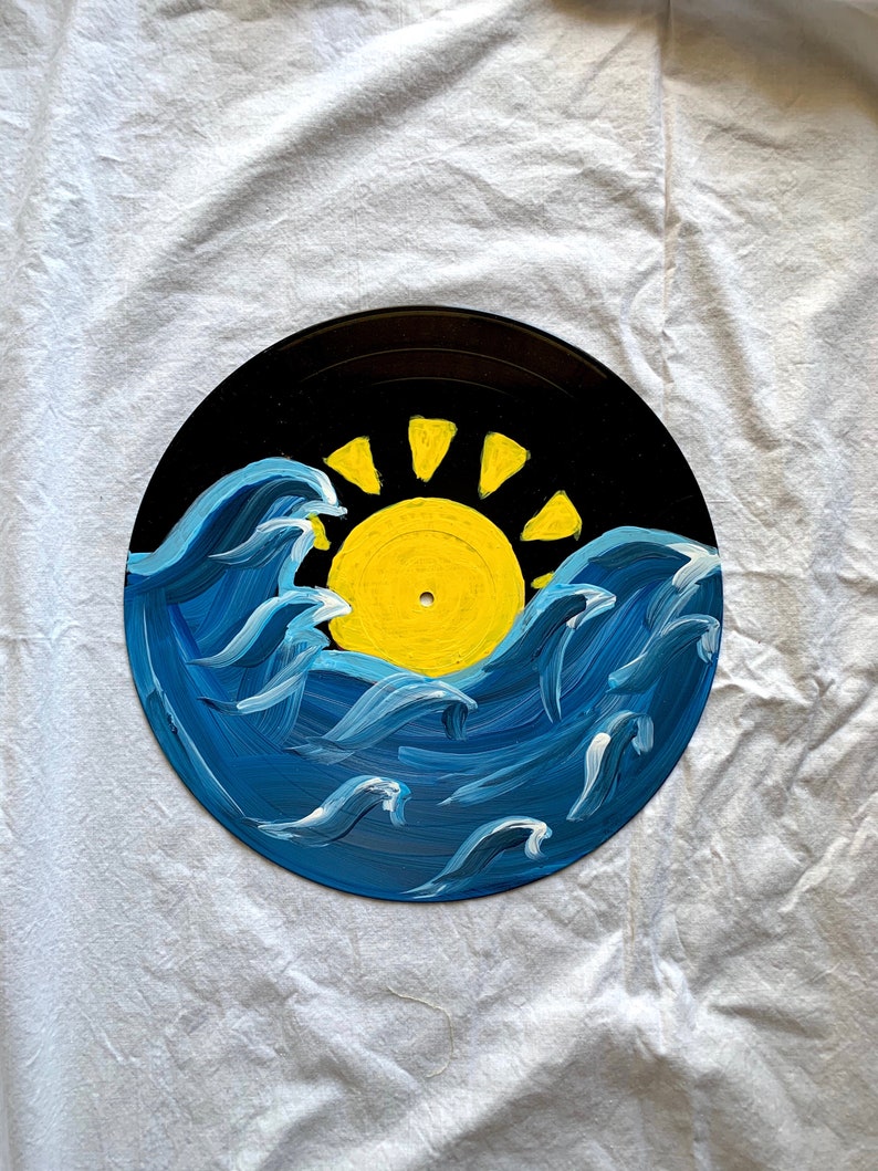 Sun and wave painted on record