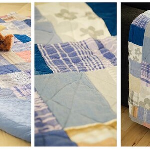 May include: A patchwork quilt made from different shades of blue, white, and beige fabric. The quilt is made up of squares and rectangles of different sizes and patterns. A teddy bear is sitting on the quilt.
