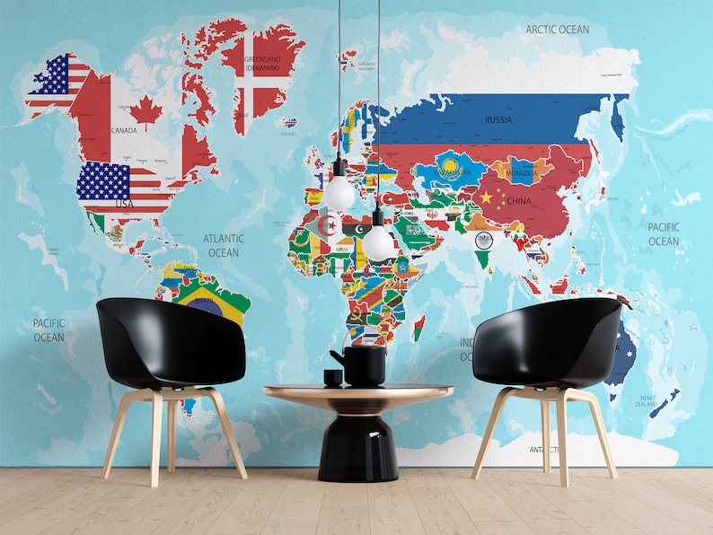 May include: A world map with flags of different countries on a light blue background. Two black chairs with wooden legs and a black and gold coffee table are in front of the map.