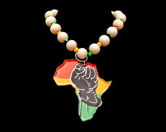 Black Fist Africa Medallion charm w/ 28 inch wood bead necklace or acrylic electroplated chain (1in wide).  Handmade with Pride and Love!