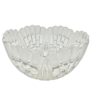 May include: A clear glass bowl with a scalloped rim and intricate cut-glass design. The bowl is perfect for serving snacks, salads, or fruit.