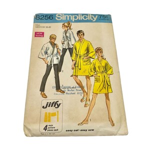 May include: Simplicity sewing pattern number 8256 for a robe. The pattern is for men, size medium 38-40. The pattern is 75 cents. The pattern shows three people wearing robes. The pattern is called "Jiffy" and says "easy cut, easy sew".