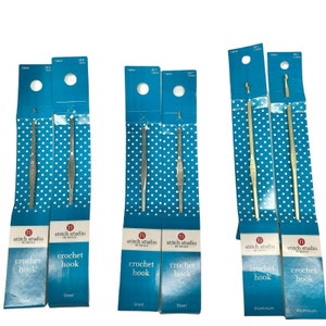 May include: Six packages of crochet hooks, two packages of steel hooks labeled "US 6" and "US 8", two packages of steel hooks labeled "US 7", and two packages of aluminum hooks labeled "US C". Each package contains one crochet hook.