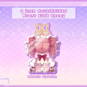 May include: A 3 inch double-sided acrylic charm featuring a pink-haired anime character with a pink bow and a pink dress. The charm is on a pink background with the text "Madoka Opening" at the bottom.