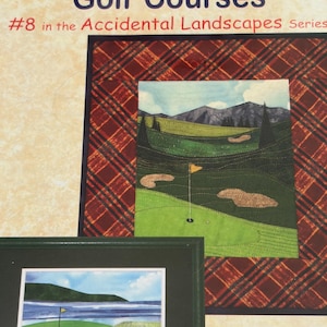 May include: A quilt pattern titled Golf Courses #8 in the Accidental Landscapes Series featuring a fabric landscape of a golf course with green fairways, sand bunkers, and mountains, framed by a red and black plaid border, with a smaller framed image.