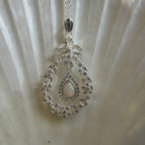 Pretty Edwardian Style Silver Opal Bow top Pendant on 18 inch silver Chain