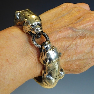 Bracelet jonc double tête de panthère en argent massif