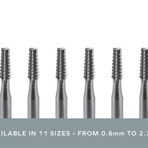 May include: Six silver dental burs with a fluted design. AVAILABLE IN 11 SIZES - FROM 0.6mm TO 2.3mm