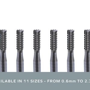 May include: Six silver-coloured, cylindrical, carbide burrs with a star-shaped head. AVAILABLE IN 11 SIZES - FROM 0.6mm TO 2.7mm