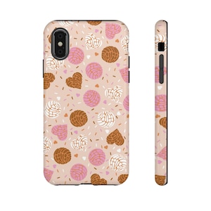 May include: A pink, white, and brown phone case with a pattern of hearts and pastries. The case is designed for an iPhone.