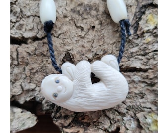 Bone Hanging Sloth Pendant with Paua Shell Eyes