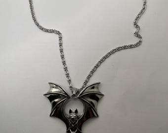 Alucrd bat with purple glass necklace