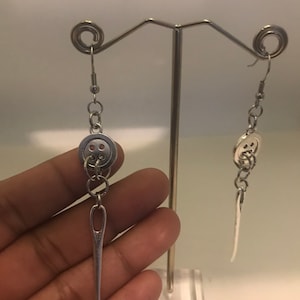Coralinee button earrings with sewing needle