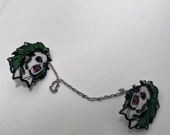 The ghost with the most collar pins, sweater clips, earrings