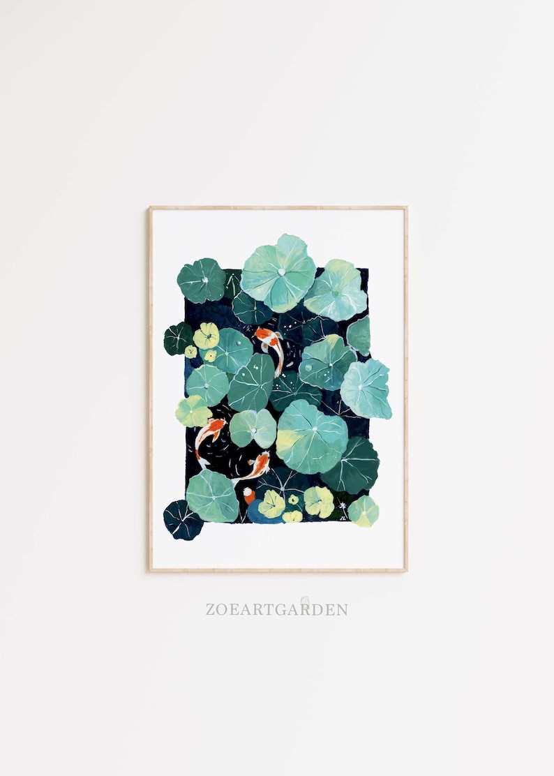 May include: A framed art print featuring a watercolor painting of a pond with koi fish and lily pads. The artwork showcases orange koi fish swimming among green lily pads against a dark blue background. The text "ZOEARTGARDEN" is at the bottom.
