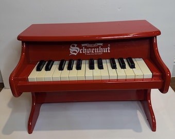 Piano infantil de madera SCHOENHUT Mini, rojo, con 25 teclas, 16,5 cm de largo x 11,5 cm de alto x 10 cm de ancho.