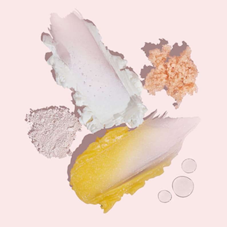 May include: Five different skincare products in various shades of pink, white, yellow, and orange. The products are arranged on a pink background.