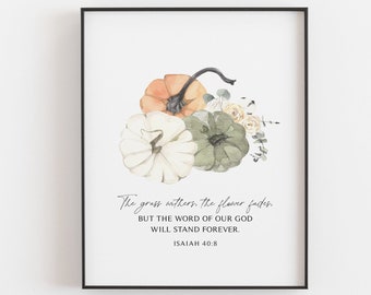 May include: A watercolor print featuring three pumpkins in shades of white, green, and orange with a floral arrangement. The print includes the text "The grass withers, the flower fades. But the word of our God will stand forever. Isaiah 40:8"