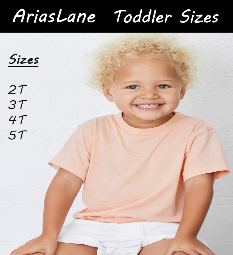 May include: A young child wearing a peach coloured t-shirt and white shorts. The child is smiling and has blonde curly hair. The text "Sizes" is written in black at the top of the image, followed by a list of sizes: 2T, 3T, 4T, 5T.
