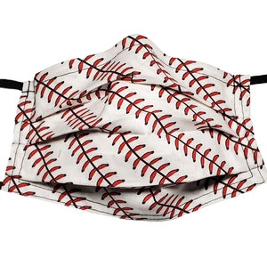 May include: A white face mask with a red baseball stitch pattern. The mask has black elastic ear loops.