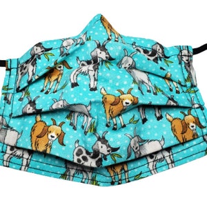 May include: A turquoise blue face mask with a repeating pattern of brown and white goats on a white polka dot background.
