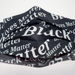 May include: Black face mask with the words "Black Lives Matter" repeated in white text.