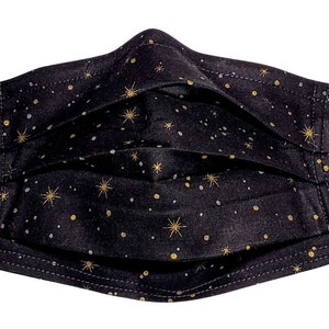 May include: Black face mask with a gold star pattern. The mask is pleated and has elastic ear loops.