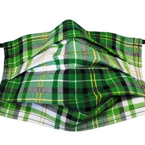 May include: Green, white, and gold plaid face mask with adjustable ear loops.