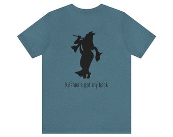 May include: A teal blue t-shirt with a black silhouette of Krishna playing a flute. The text "Krishna's got my back" is printed below the silhouette.