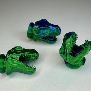Puxadores de gaveta em formato de dinossauro T-Rex | Puxadores com cabeça de dinossauro para quarto infantil, estilo jurássico, nas cores verde e azul.