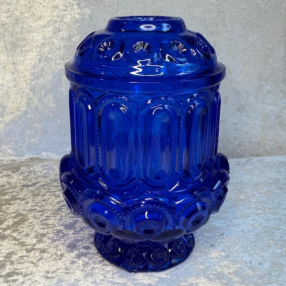 A handmade two-piece cobalt blue resin fairy lamp with moon-and-stars motif — glows like something from a Victorian séance in the best way.